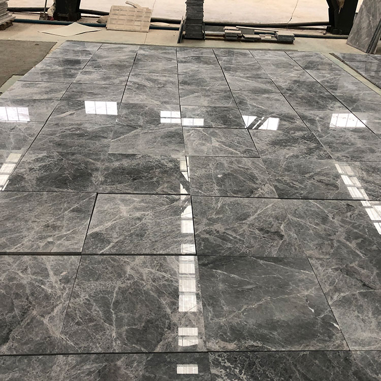 Are there any special considerations for installing marble tiles in high-traffic areas or commercial spaces?